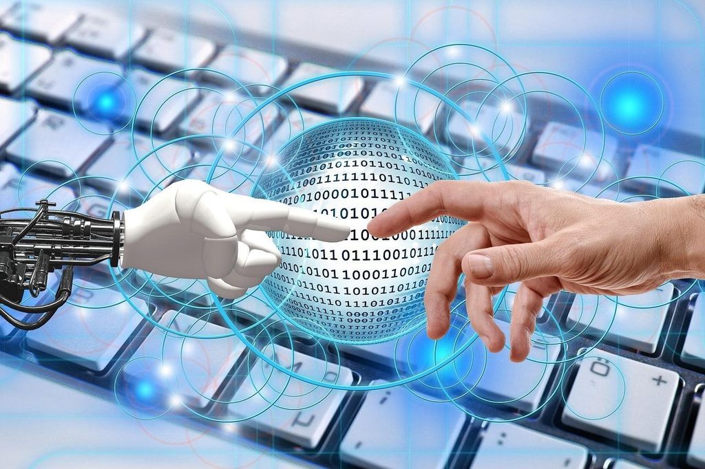 ロボットと人の手が触れ合うイメージ